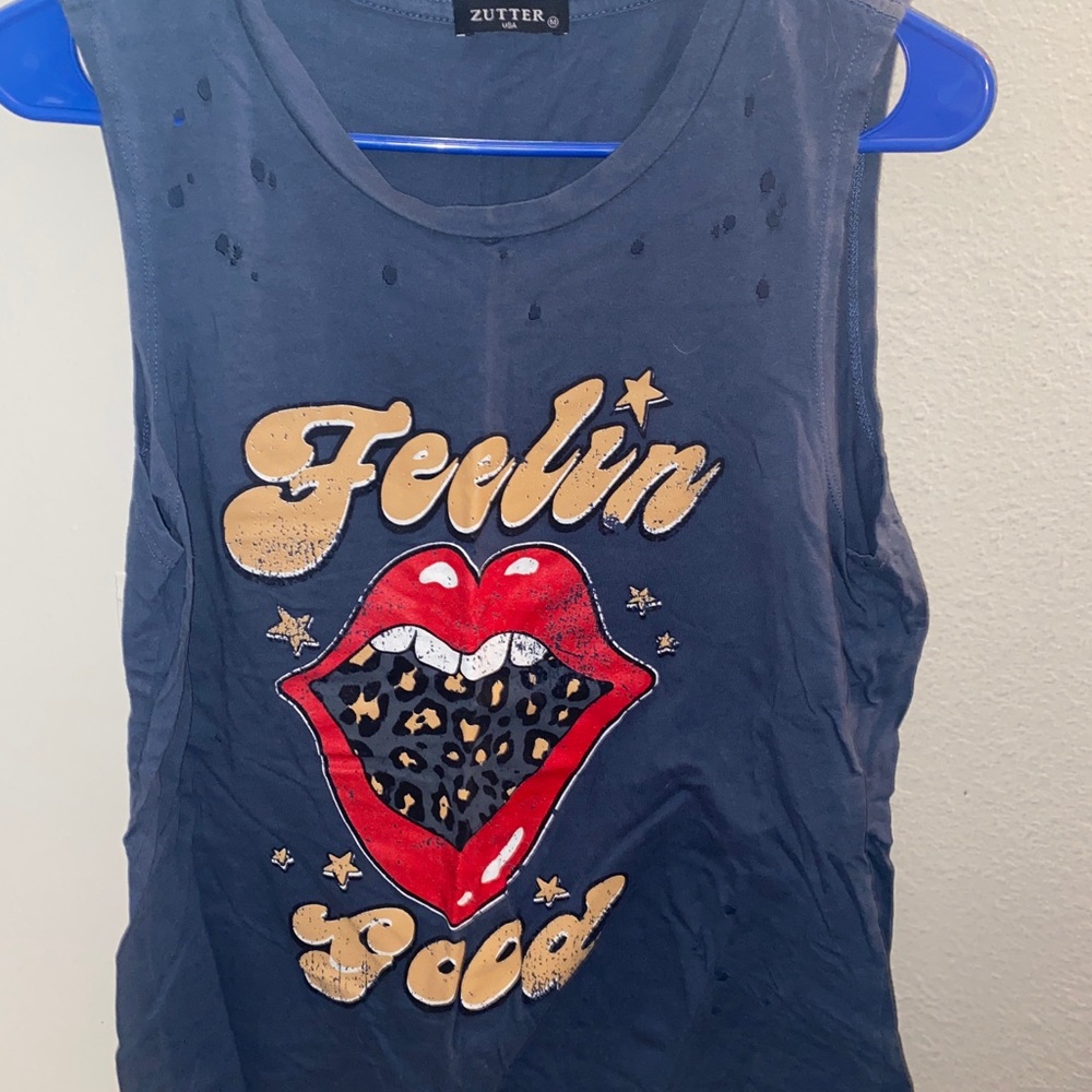 Blue tank top from a local boutique. It’s supposed to have holes and look worn.